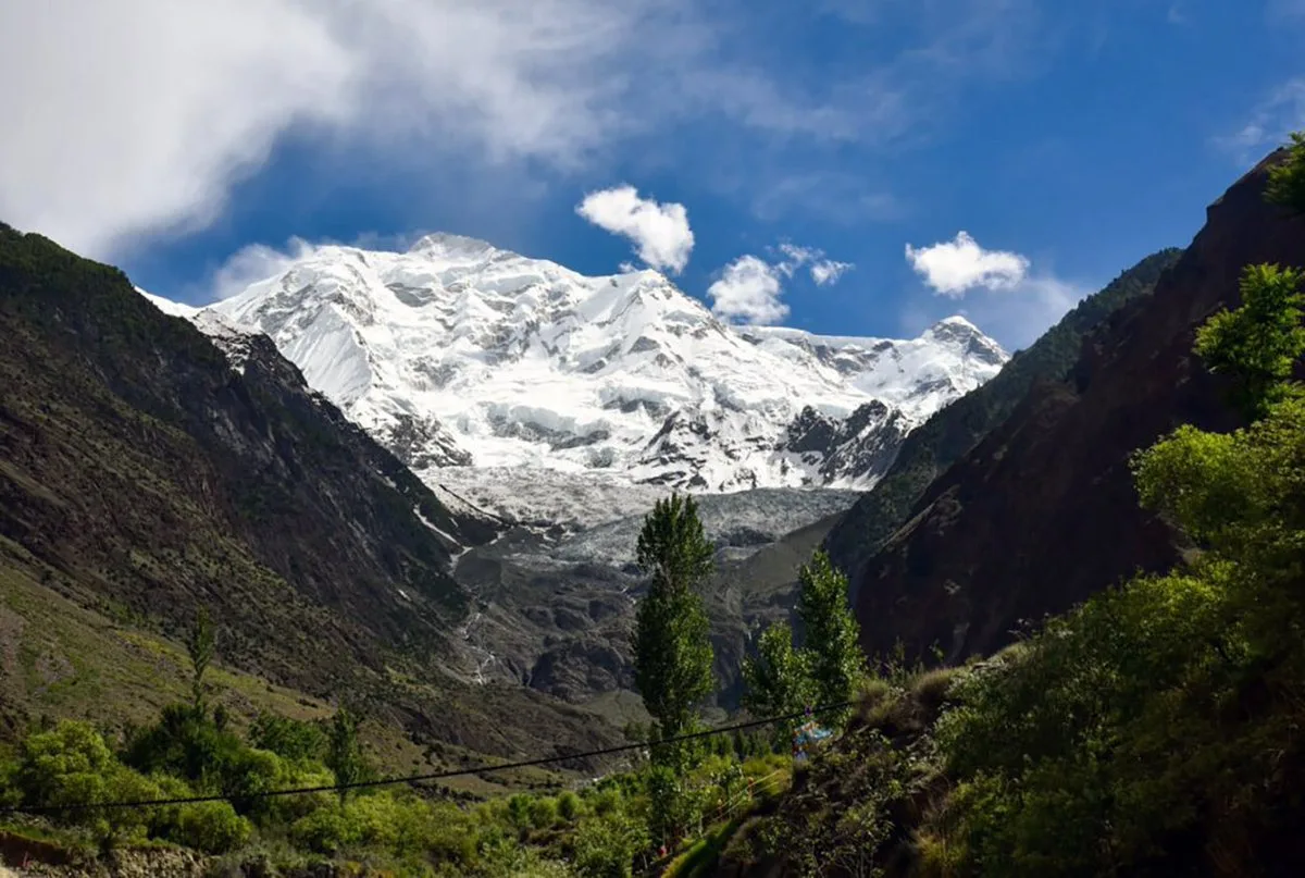 The snow-clad face and glacier of Rakaposhi (7,788 m) seen from the Ghulmet view point on the Karakoram Highway, Hunza