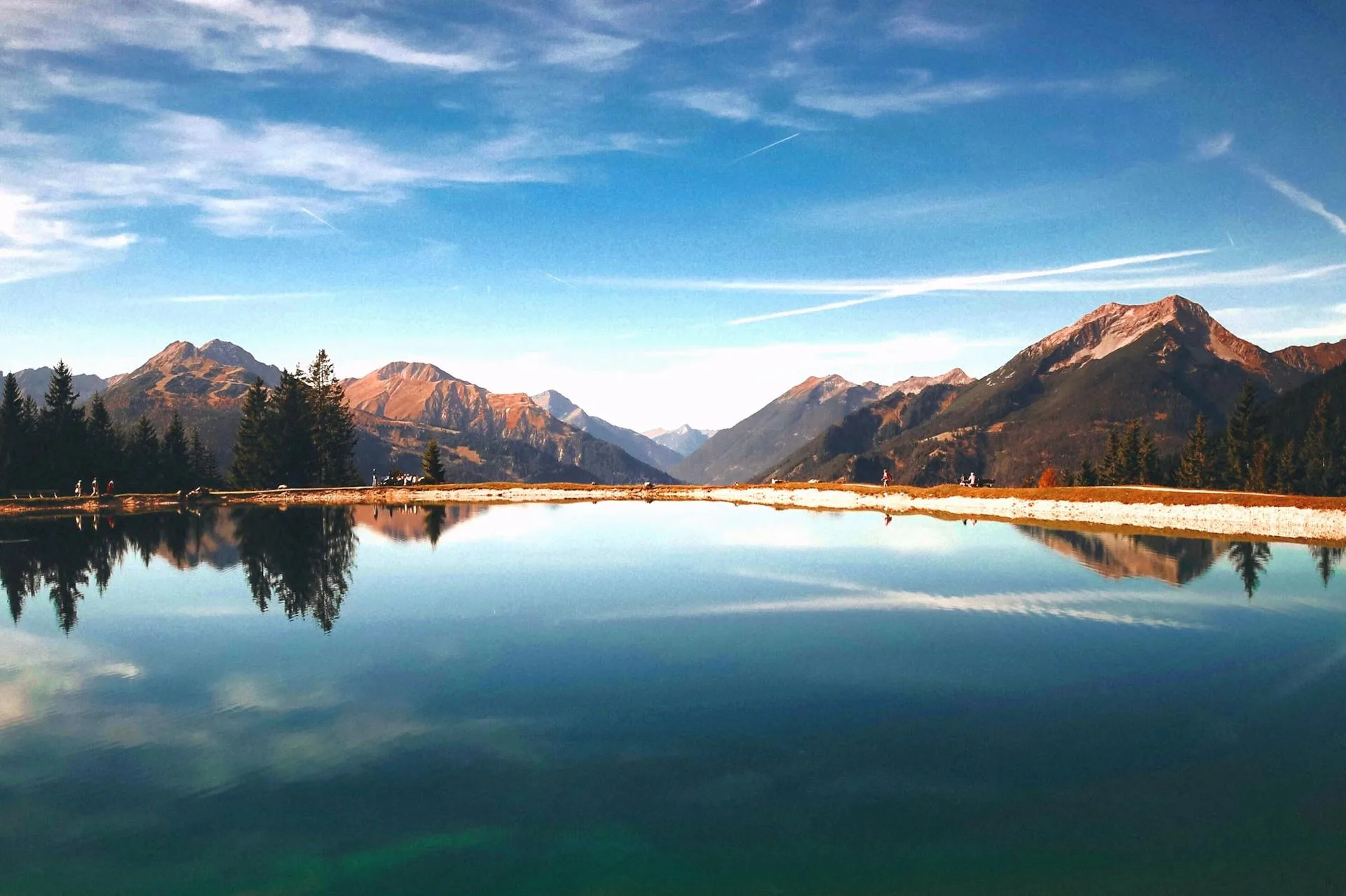 Brown mountains surrounding a high-altitude lake