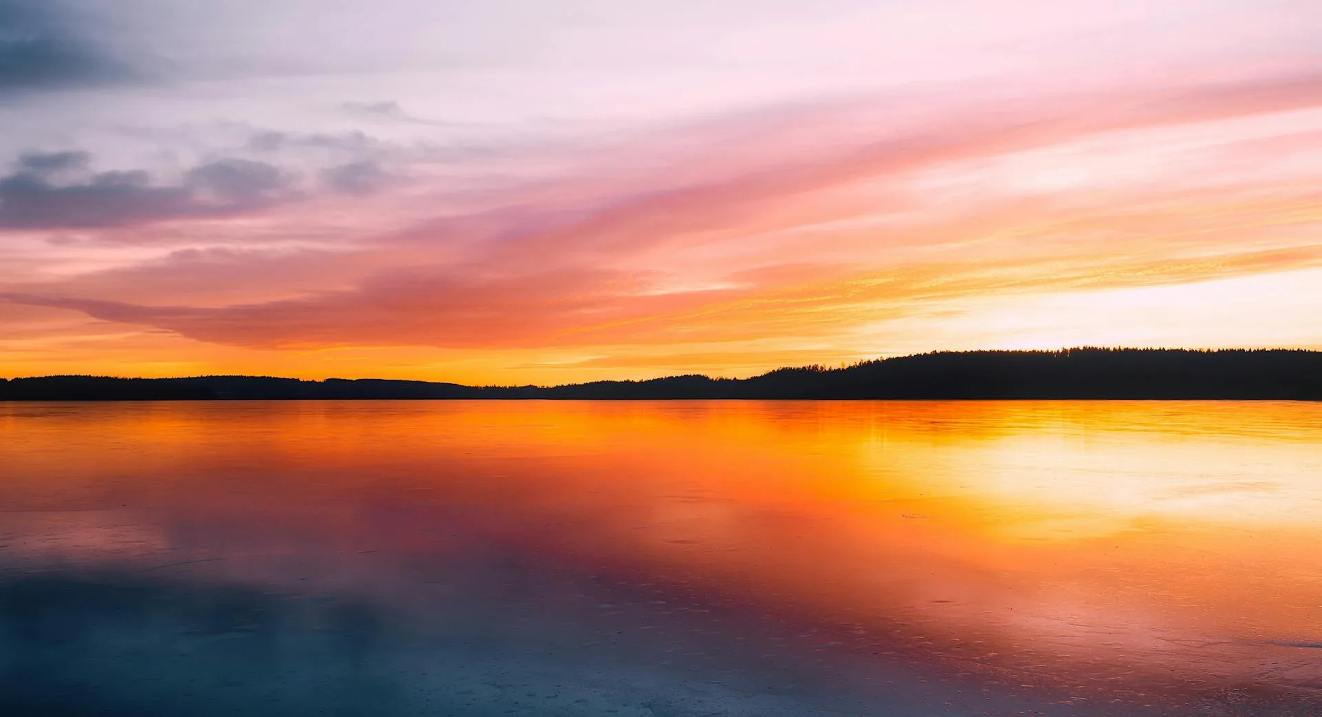 Lake beside mountain during golden hour