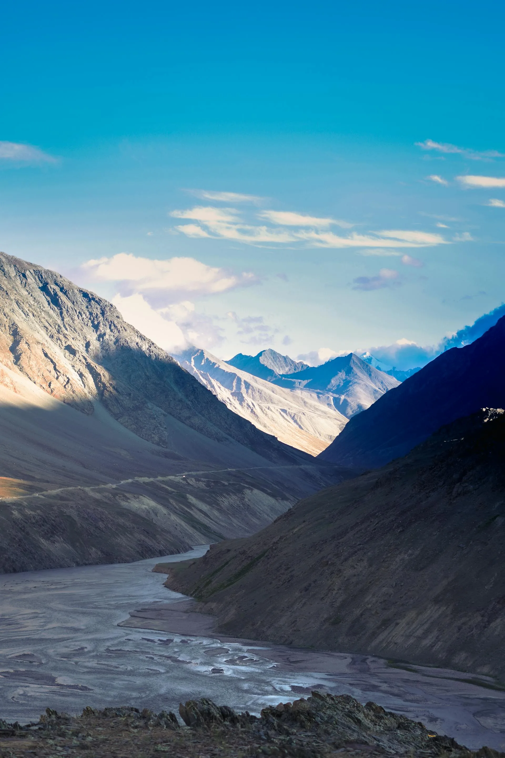 Mountain valley with river through rugged terrain