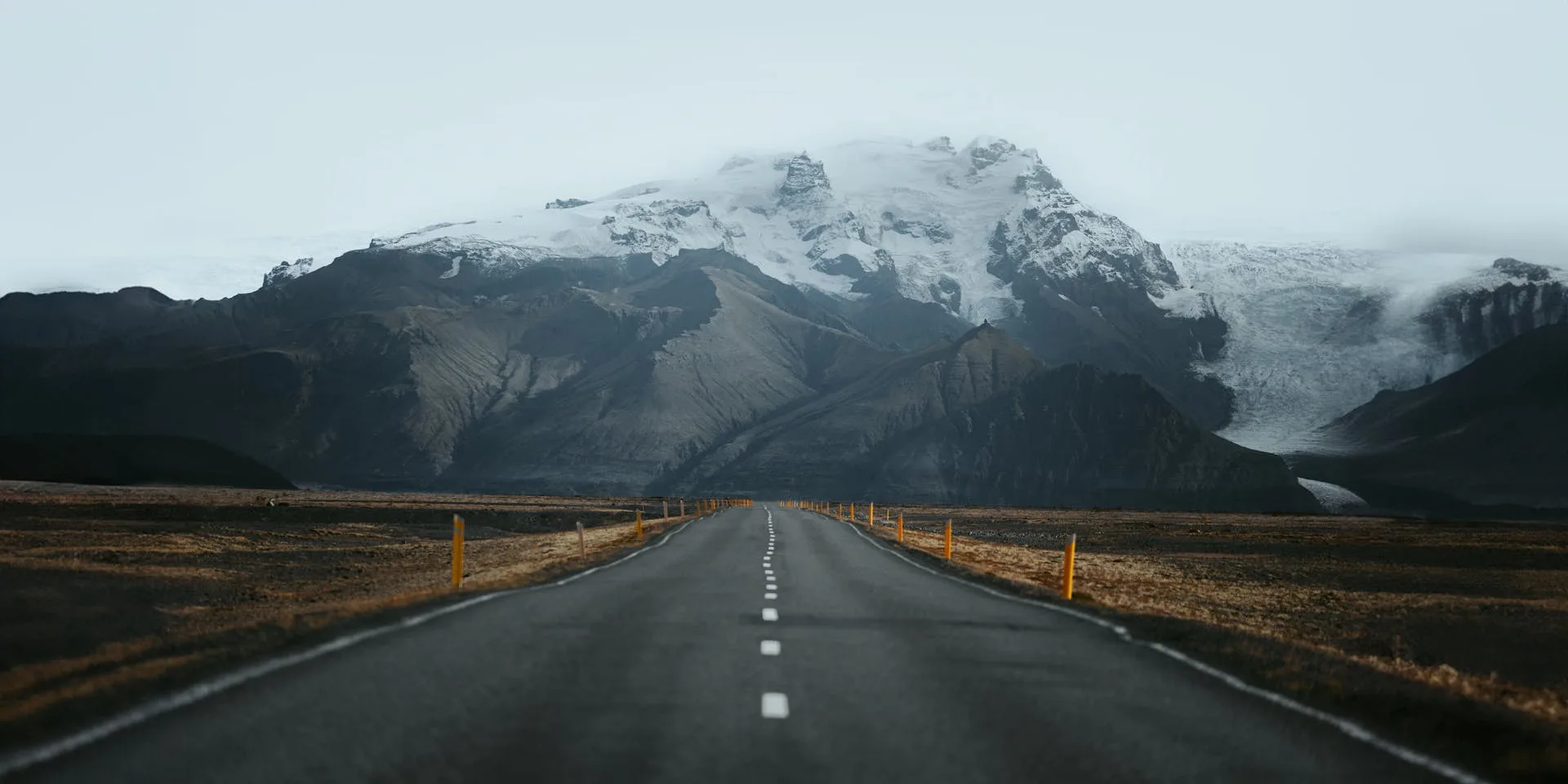 Road leading toward snowy mountains