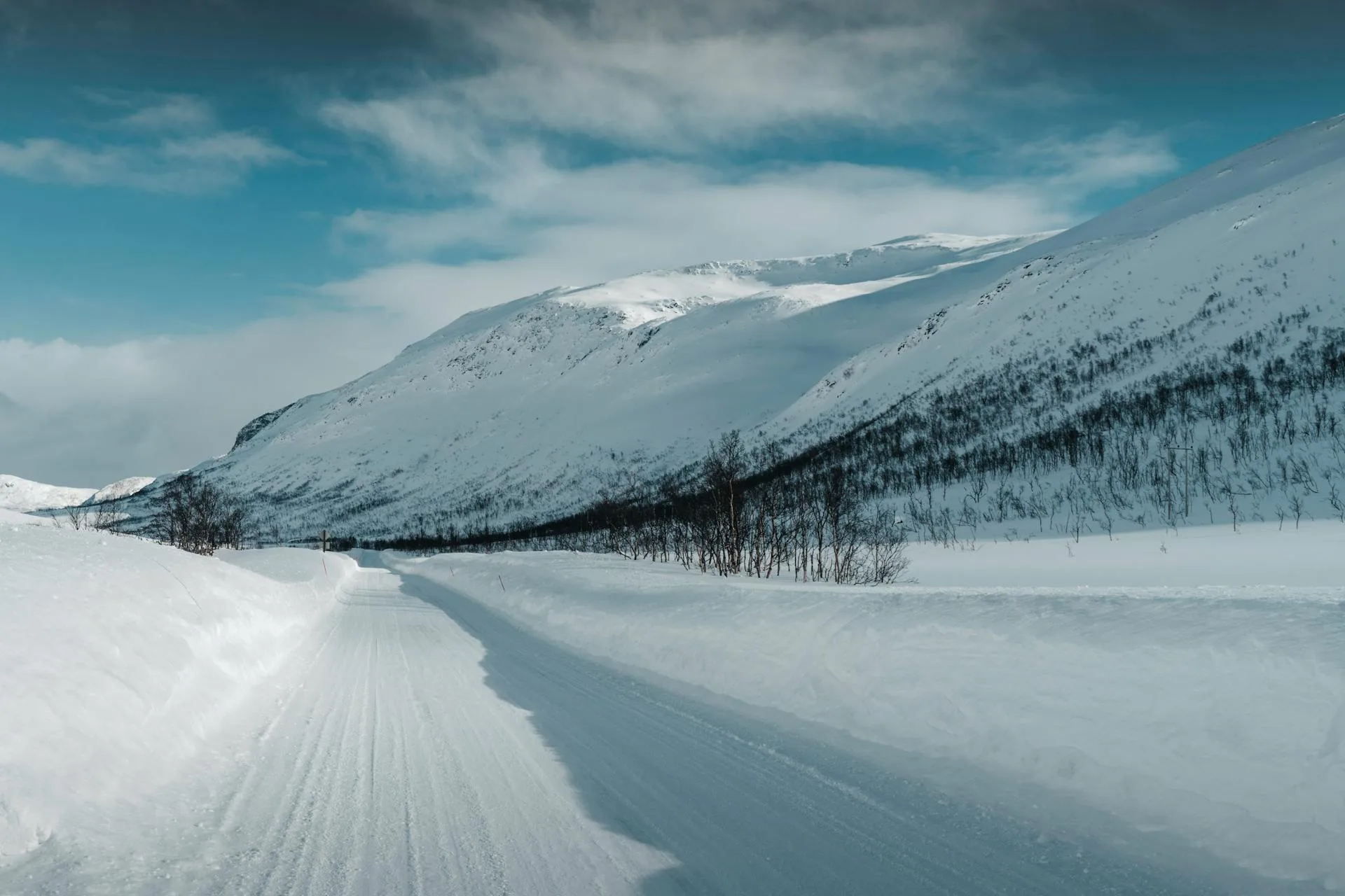 Scenic snowy road through mountain landscape