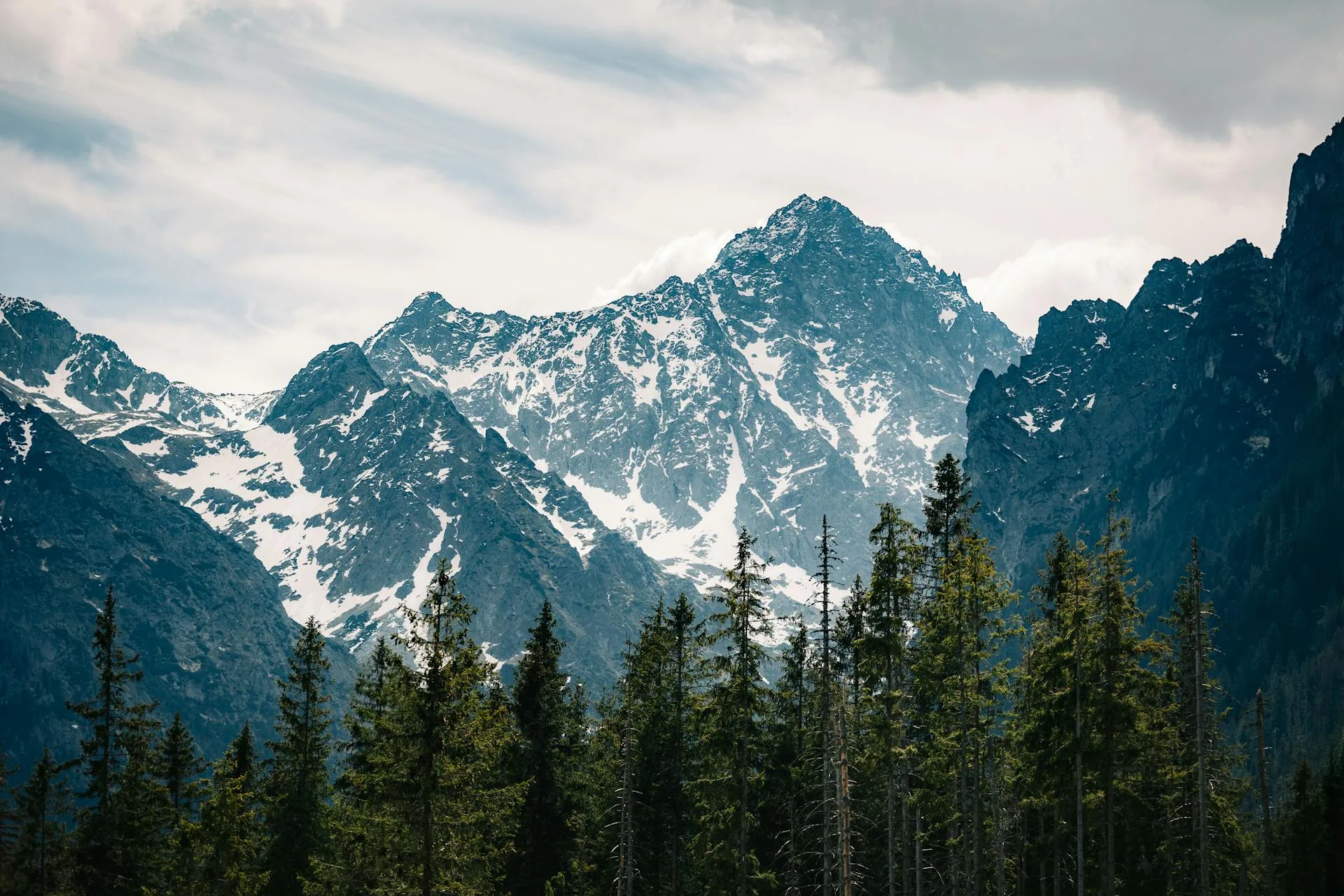 A scenic view of a snow-capped mountain range