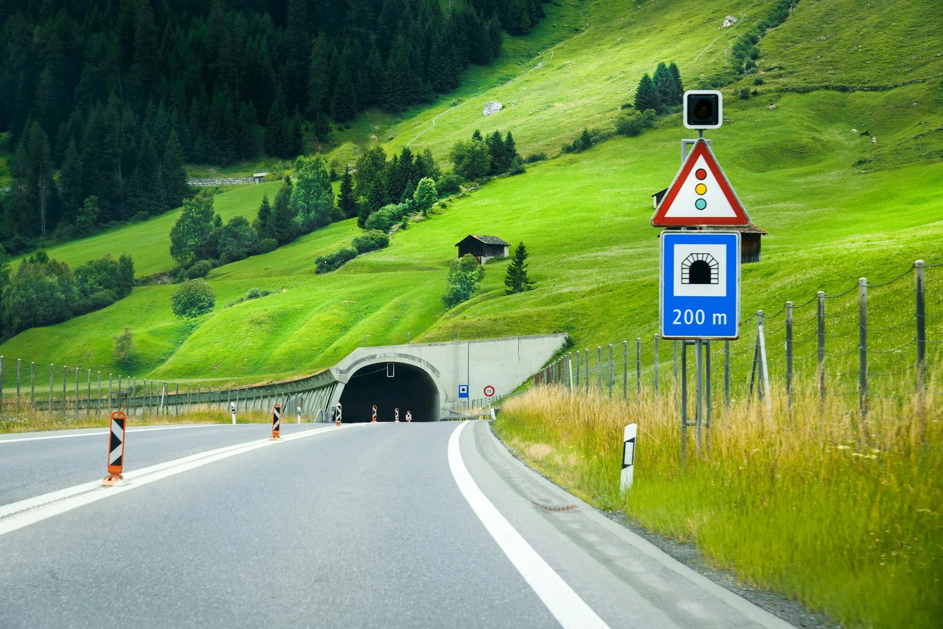 Mountain road leading to a tunnel