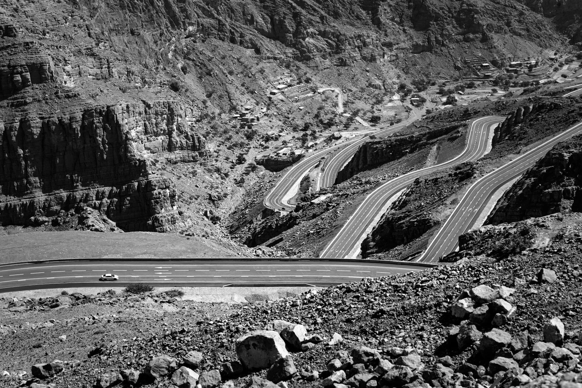 Winding mountain road through rugged landscape
