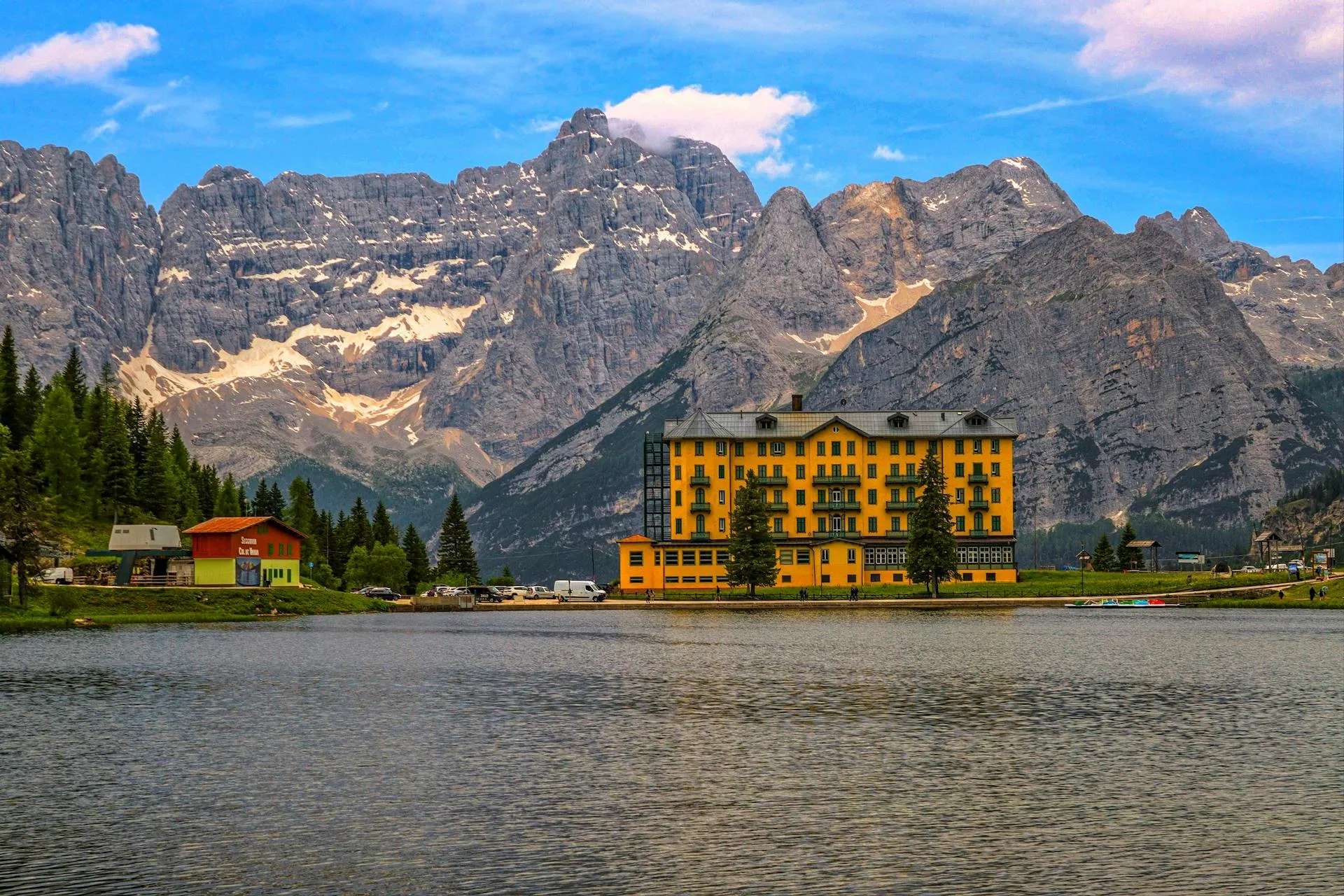 Mountain view with alpine hotel beside lake