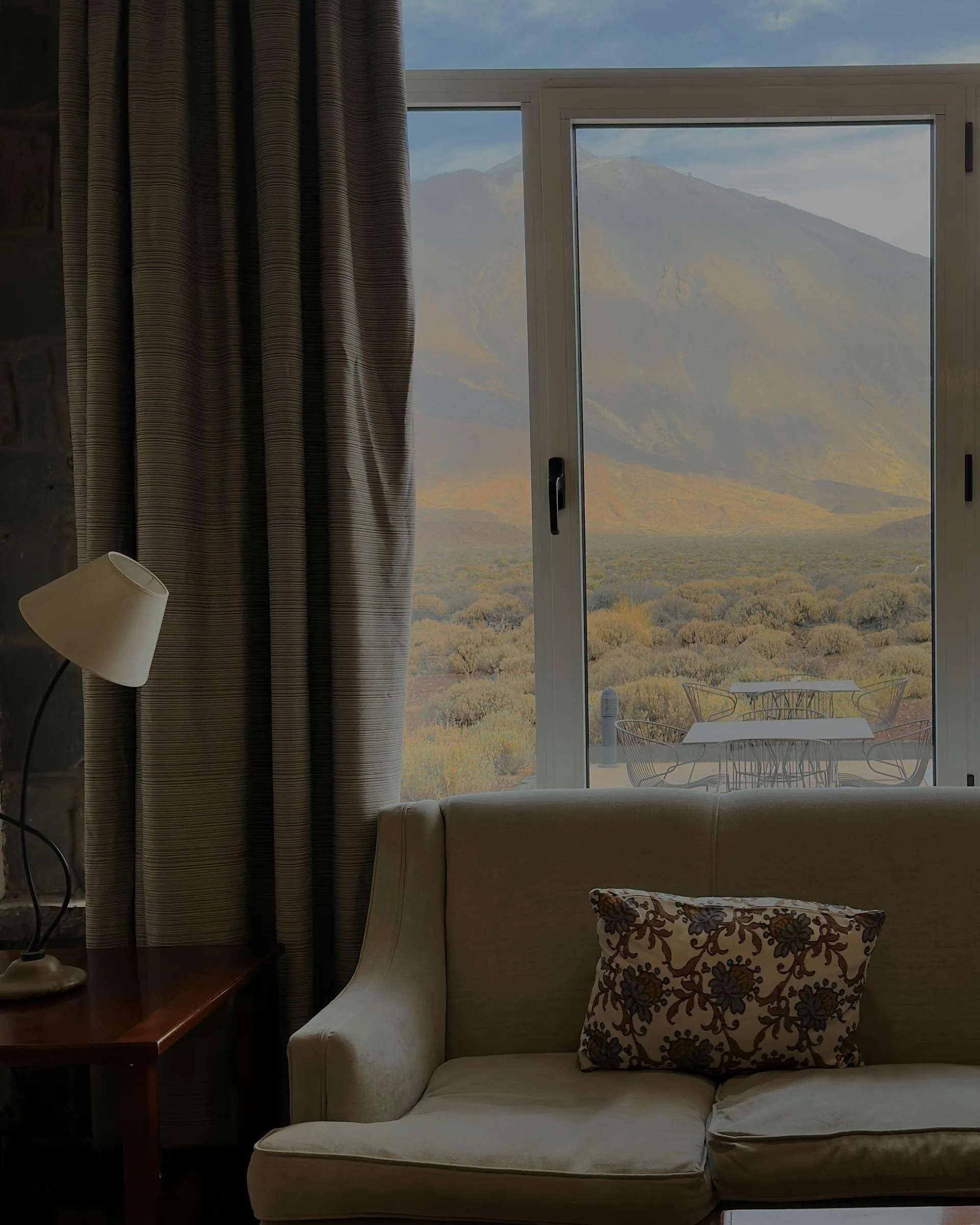 Cozy interior with mountain view through window