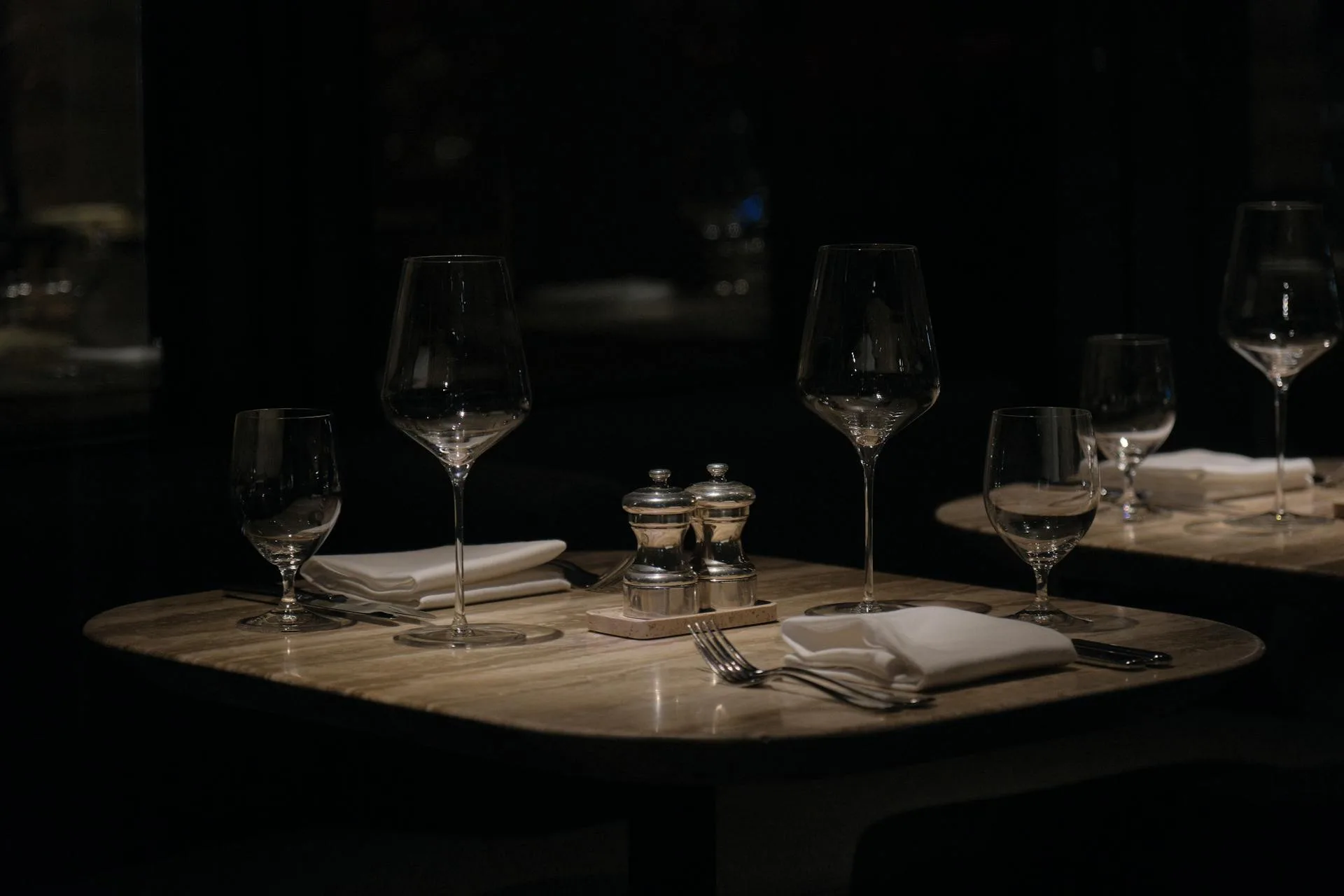 Elegant dining setting with wine glasses