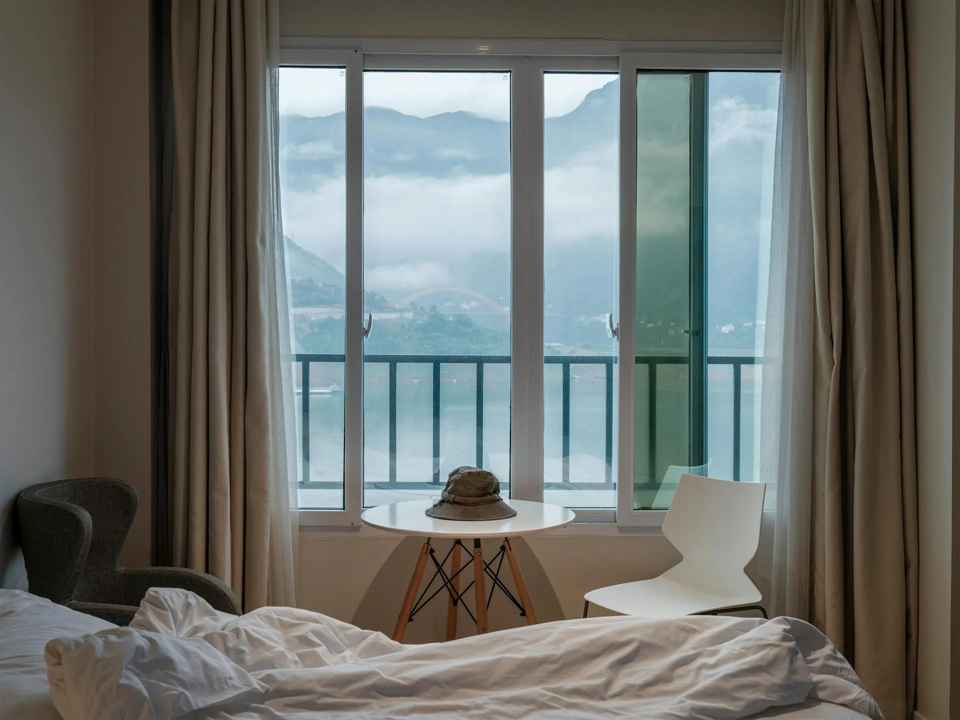 Serene hotel room with panoramic mountain view