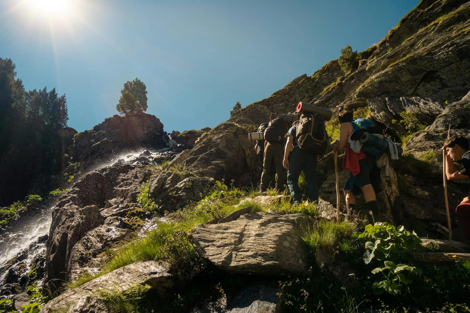 Backpackers hiking through dramatic mountain terrain