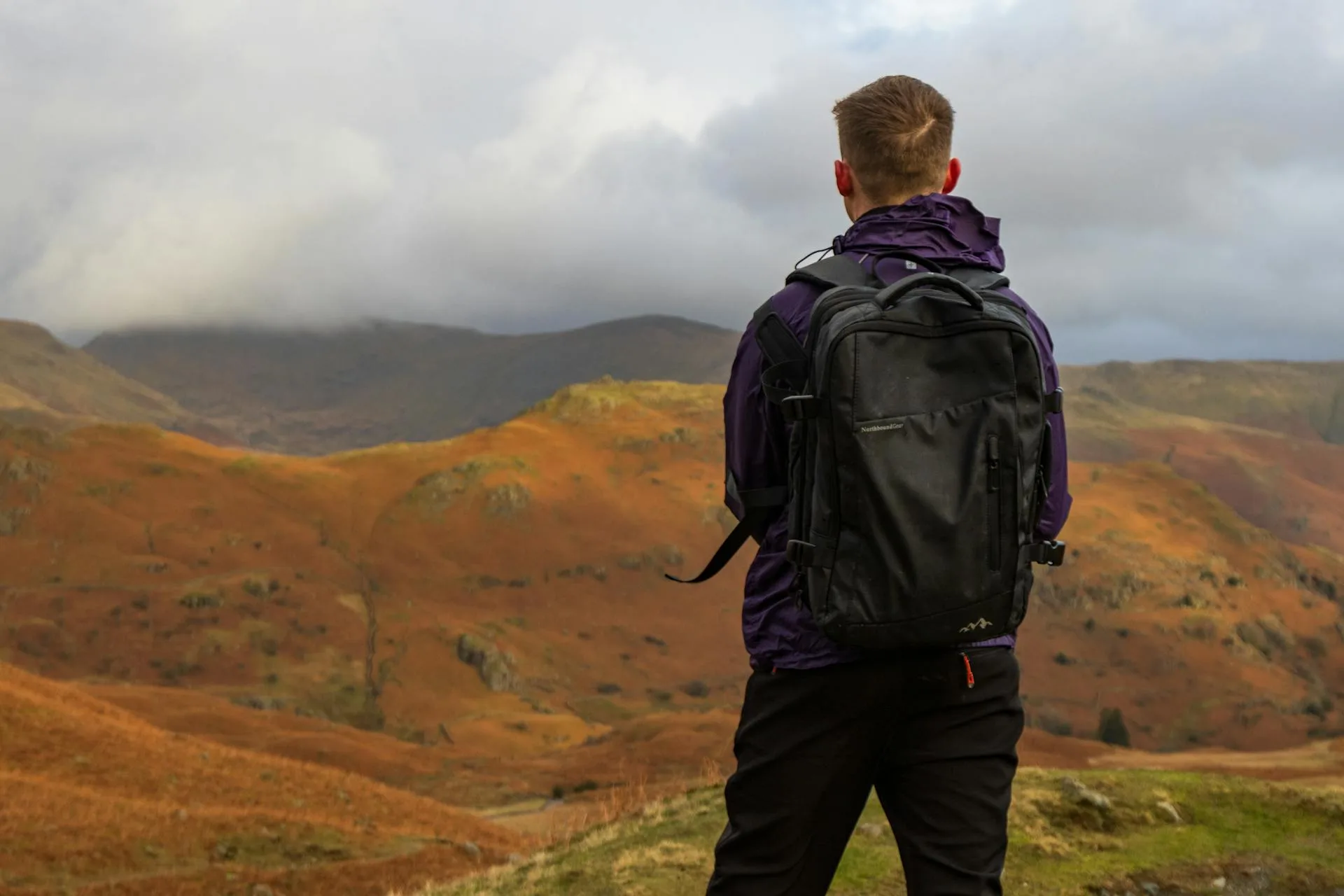 Hiker looking at vast mountain panoramic view
