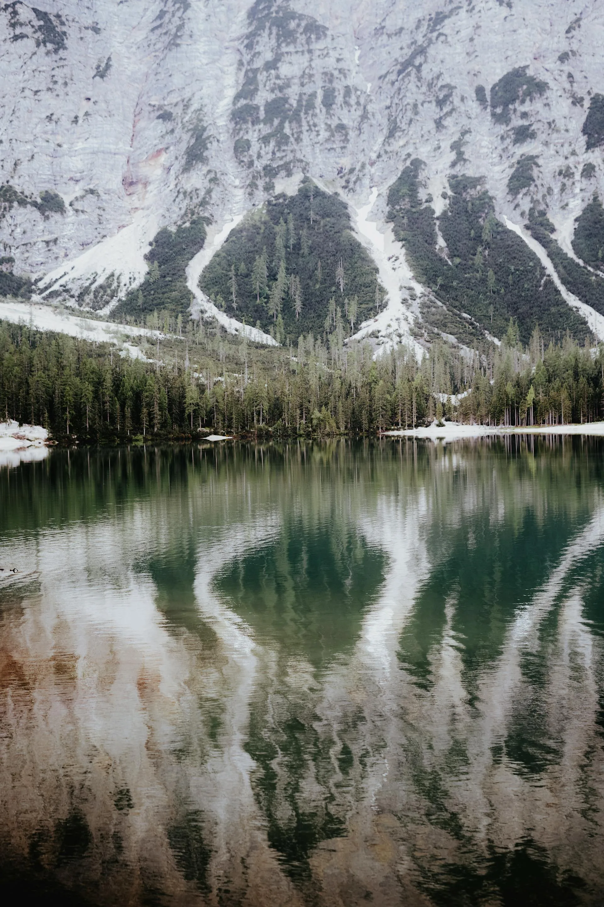 A stunning alpine lake reflecting the surrounding mountains