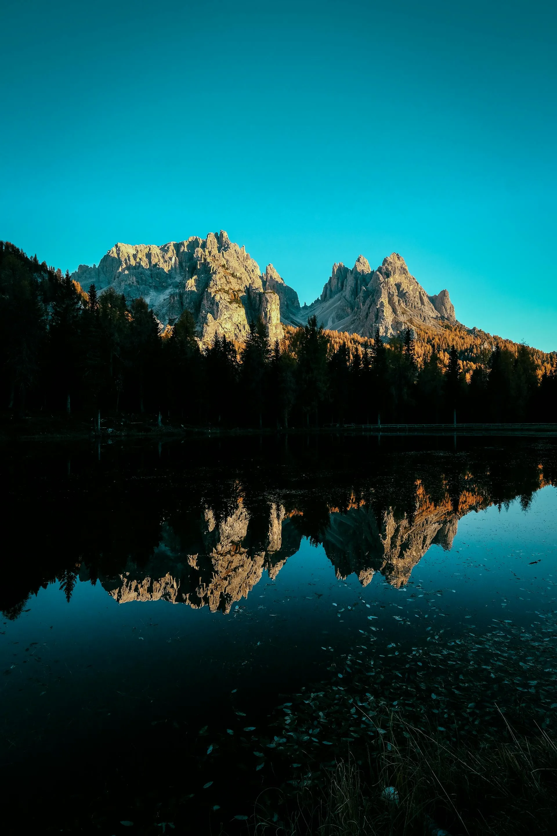 A serene mountain lake with reflective still waters