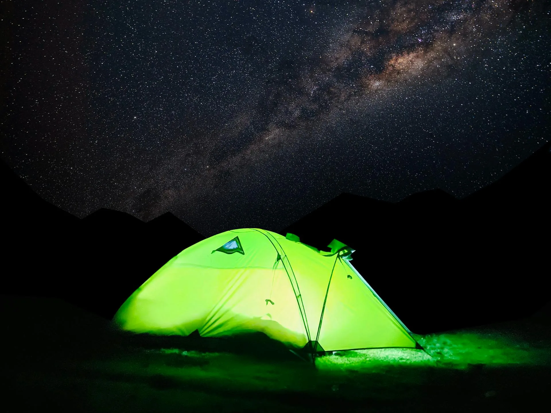 A tent beneath the stunning Milky Way galaxy