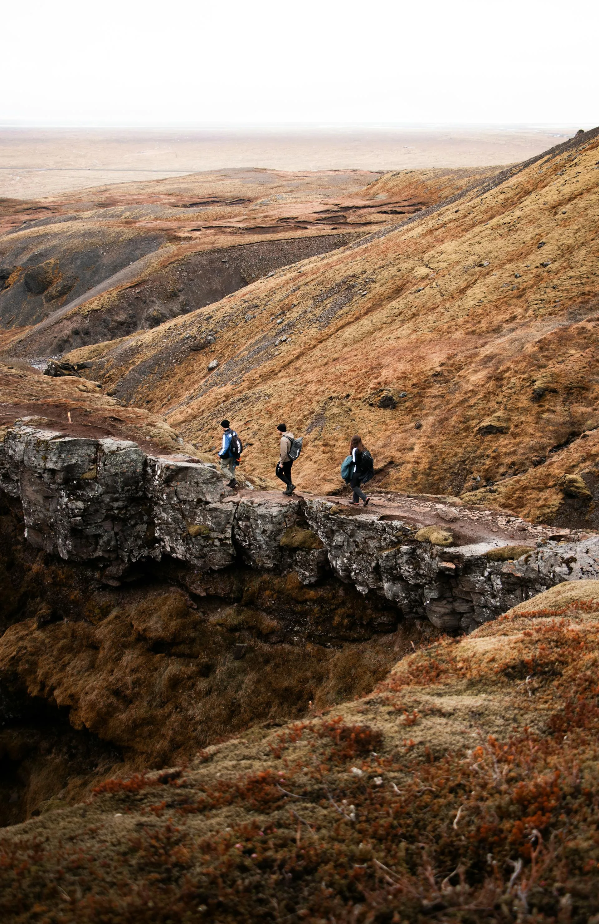 Trekkers hiking through a dramatic mountain landscape