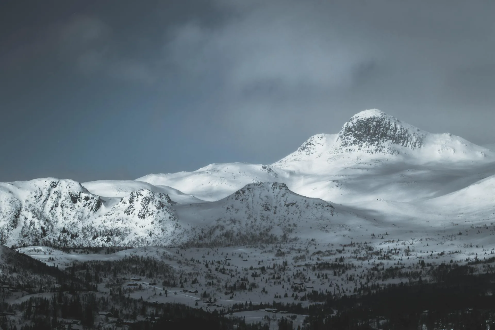 A towering snow-capped mountain peak on the trek route