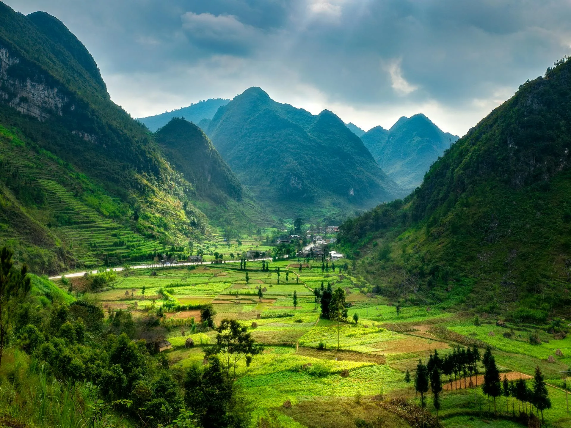 Green valley surrounded by majestic mountains